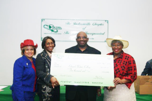 A check was presented to Edward Waters College for needy students. Shown are event chair Maretta LeBlanc, Chapter President Betty Cody, EWC representative Dr. Eric Jackson and Elizabeth Yates