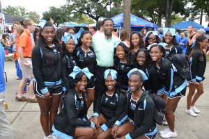 Oct. 2013, Mayor Alvin Brown with cheerleaders from Ribault High School at the annual Florida-Georgia Game