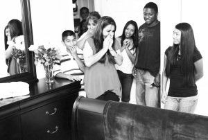 Shocked family reacts as they visit the fully furnished bedroom of the house granted to  them by Warrick Dunn through his charity. PHOTO courtesy of Warrick Dunn Charities 